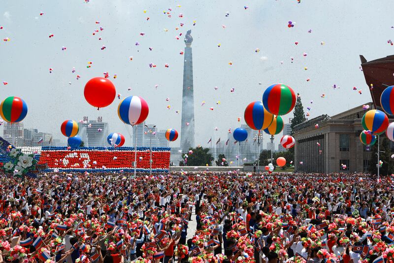 North Koreans attend the official welcome ceremony for visiting Russian President Vladimir Putin in Kim Il Sung Square, Pyongyang. AP