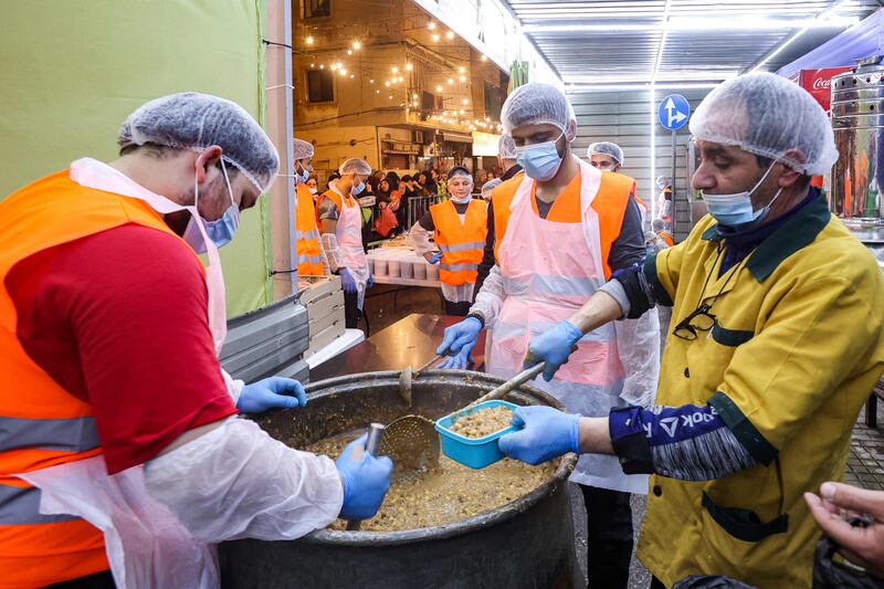 Volunteers prepare Ramadan pre-dawn suhoor meals for distribution in the southern suburbs of Beirut on Saturday. AFP
