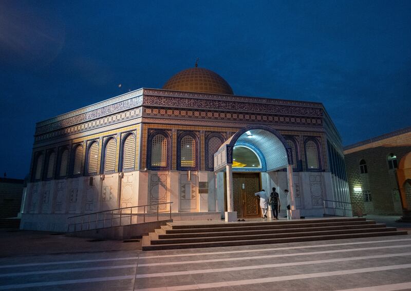 Worshippers arrive on the first morning of Eid Al Adha at Bani Hashim Mosque in Abu Dhabi. Victor Besa / The National