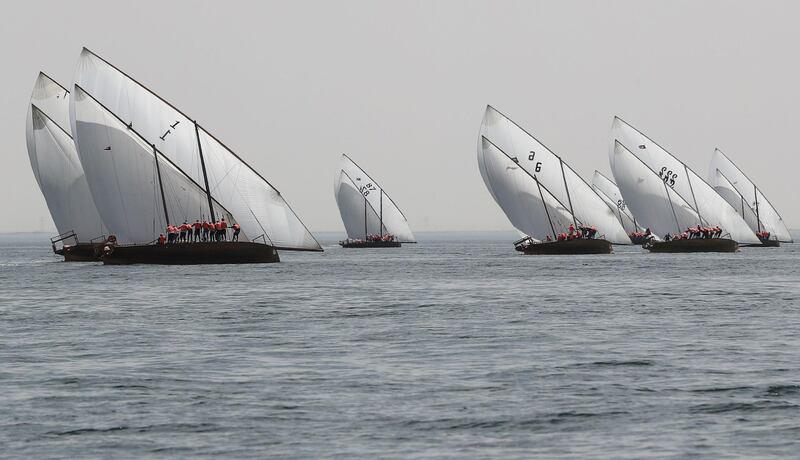 Emirati competitors sail traditional dhows during the Marwah Traditional Dhow Sailing race, as part of Al-Dhafra Water Festival at Mirfa beach, outside Abu Dhabi.  AFP