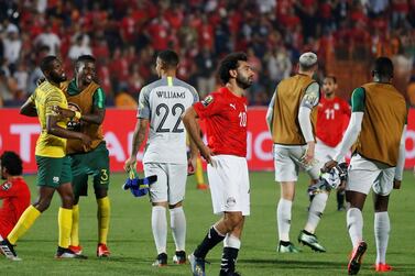 Mohamed Salah, centre, had to put a brave face on as South Africa players celebrated their African Cup of Nations success around him. Reuters