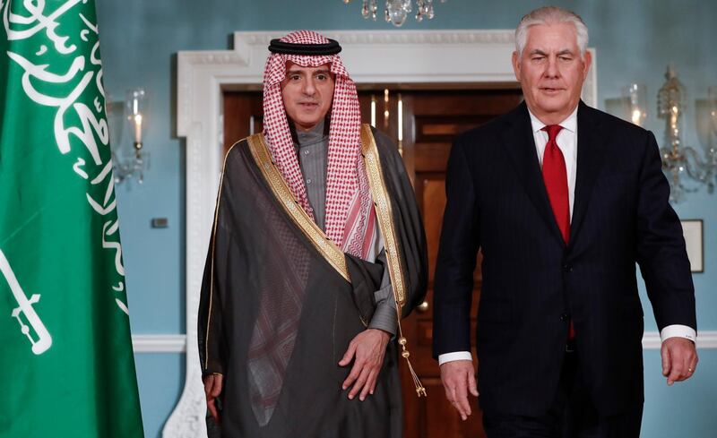 Secretary of State Rex Tillerson, right, walks with Saudi Arabian Foreign Minister Adel al-Jubeir, left, at the U.S. State Department in Washington, Friday, Jan. 12, 2018. (AP Photo/Pablo Martinez Monsivais)