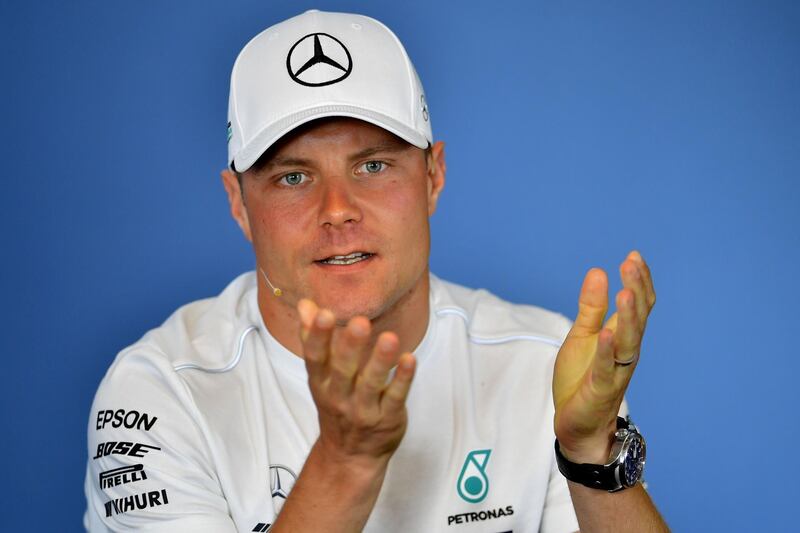 Mercedes' Finnish driver Valtteri Bottas gestures during the drivers press conference ahead of the Formula One Hungarian Grand Prix at the Hungaroring circuit in Mogyorod near Budapest, Hungary, on July 26, 2018.  / AFP / ANDREJ ISAKOVIC
