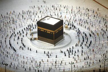 A handout picture provided by Saudi Ministry of Media on August 2, 2020 shows Muslim pilgrims circumambulating around the Kaaba, Islam's holiest shrine, at the centre of the Grand Mosque in the holy city of Mecca, while mask-clad and along specific pre-ordained rings as measures due to the COVID-19 coronavirus pandemic, on the final day of the annual Muslim Hajj pilgrimage. - Massive crowds in previous years triggered deadly stampedes during the ritual, but this year only up to 10,000 Muslims are taking part after millions of international pilgrims were barred because of the covid-19 pandemic crisis. (Photo by - / Saudi Ministry of Media / AFP) / === RESTRICTED TO EDITORIAL USE - MANDATORY CREDIT "AFP PHOTO / HO / SAUDI MINISTRY OF MEDIA" - NO MARKETING NO ADVERTISING CAMPAIGNS - DISTRIBUTED AS A SERVICE TO CLIENTS ===