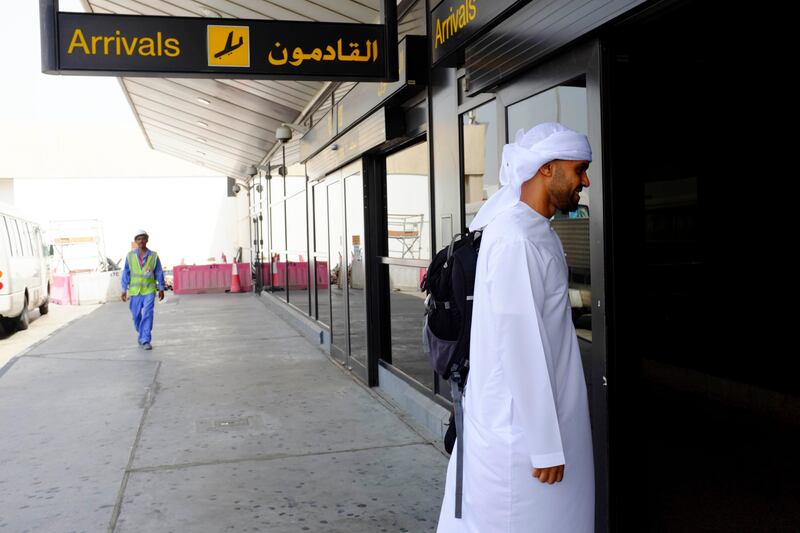 Dubai, United Arab Emirates - August 01 2013 - National reporter Thamer Al Subaihi walks into immigration after exiting the new Rotana Jet after landing in Dubai International Airport. The jet operates as a commuter flight daily between Abu Dhabi and Dubai. Four National reporters raced from Abu Dhabi to Dubai using various modes of transport to see which vehicle took the least time between two cities.  (Razan Alzayani / The National) 