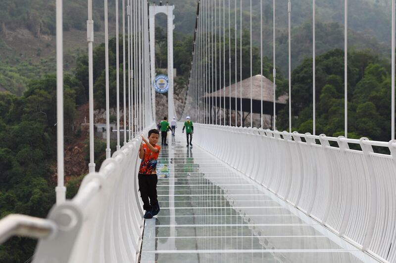 A young visitor makes his way across the bridge. 