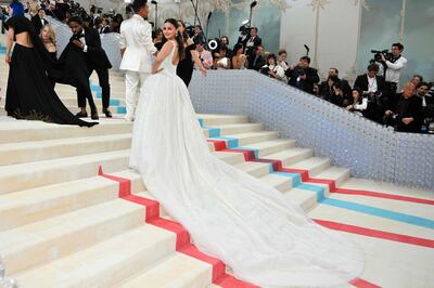 Bhatt shows off the train of her dress on the Met Gala stairs. Photo: Angela Weiss / AFP