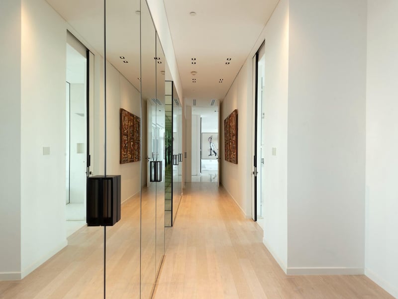 A mirror-lined hallway. Courtesy Luxhabitat Sotheby's International Realty