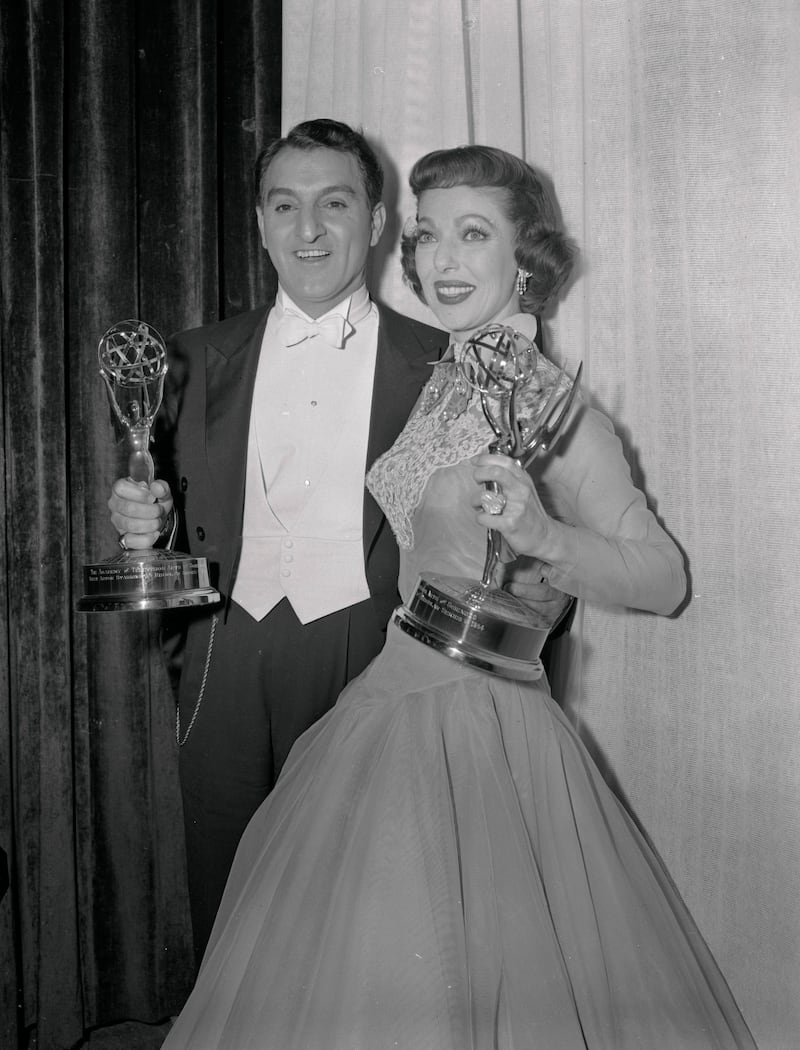 Danny Thomas and Loretta Young hold their "Emmy" Awards at the Moulin Rouge restaurant in Hollywood after they were honored at the Seventh Annual Awards Dinner of the Academy of Television Arts and Sciences. Thomas was named "Best Actor starring in a regular series" Make Room for Daddy, and Miss Young won the "Best Actress" award in the same category The Loretta Young Show. (Photo by Bettmann/CORBIS/Bettmann Archive)