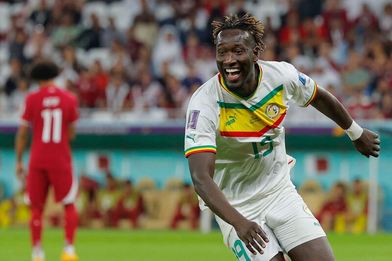 Famara Diedhiou celebrates after scoring Senegal's second goal in their 3-1 win over Qatar in the World Cup Group A match at Al Thumama Stadium in Doha, on November 25, 2022. AFP