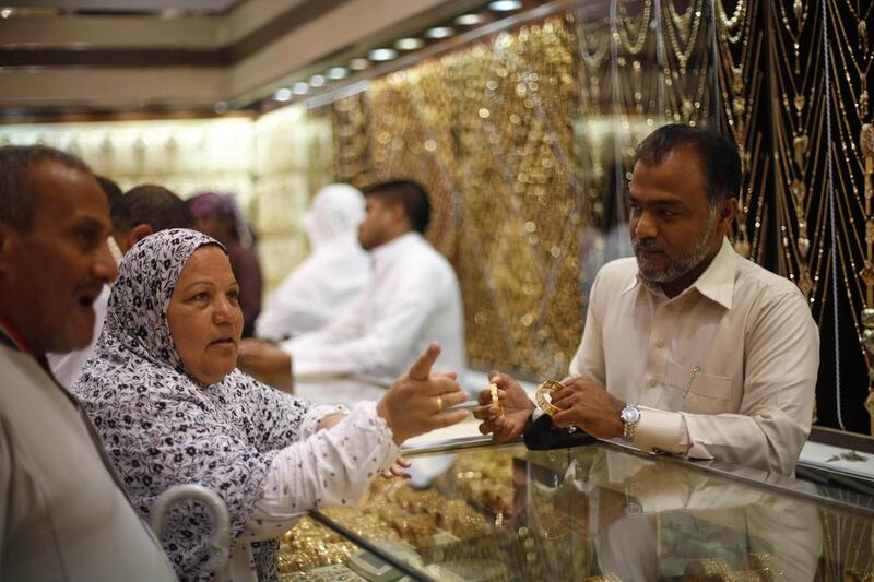Pilgrims shop at a jewellery store ahead of this year's Haj in the holy city of Mecca. Ibraheem Abu Mustafa / Reuters



