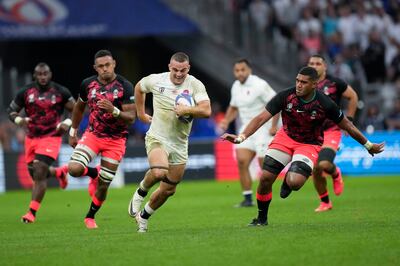 England's Ben Earl before being tackled by Fiji's Sireli Maqala, right, after a late run during the Rugby World Cup 2023 quarter-final match at the Stade Velodrome in Marseille. PA