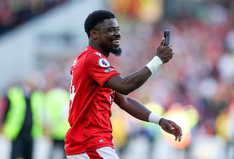 Serge Aurier of Nottingham Forest films the celebrations on his phone. Getty Images
