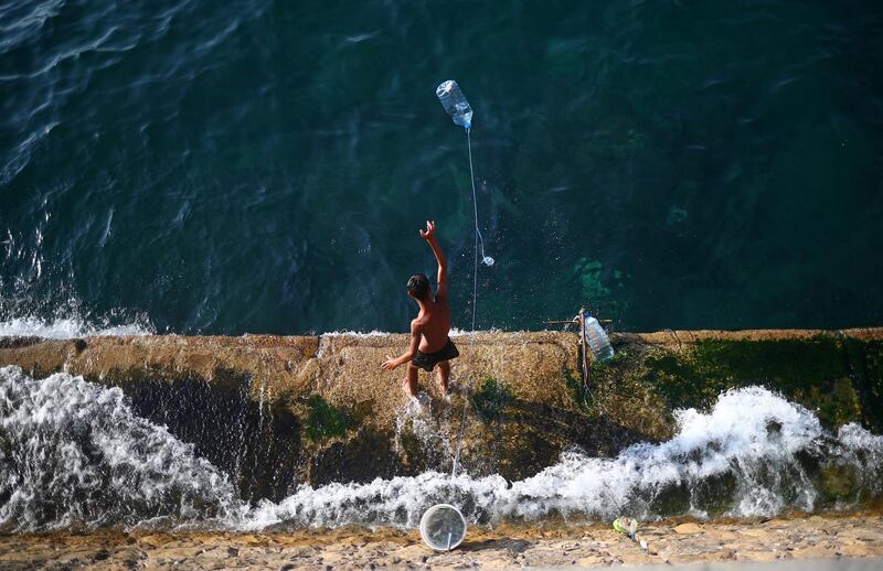 A boy is seen fishing at Beirut's Corniche, Lebanon. Reuters