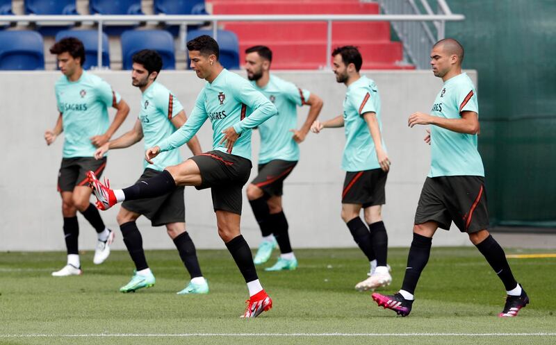 Cristiano Ronaldo, Pepe and Portugal teammates go through a warm-up routine during a training session at Illovszky Rudolf Stadium. Reuters