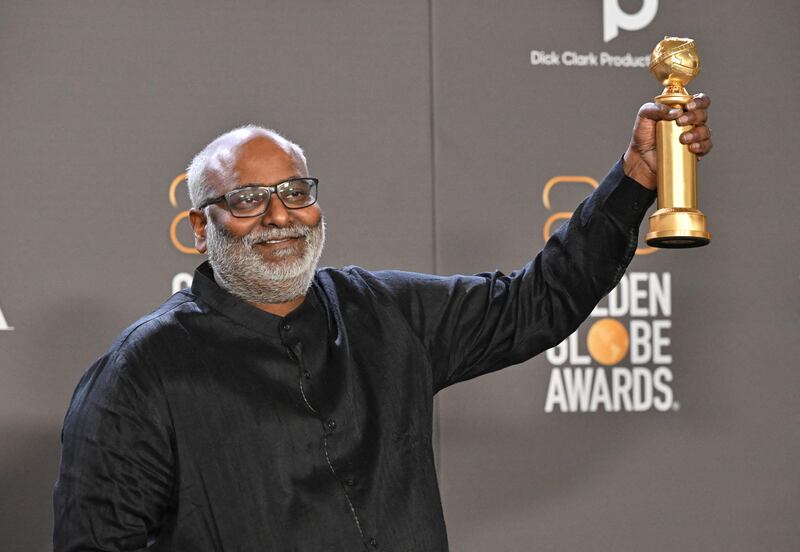 M M Keeravani poses with the Golden Globe for Best Original Song - Motion Picture for Naatu Naatu from RRR. AFP