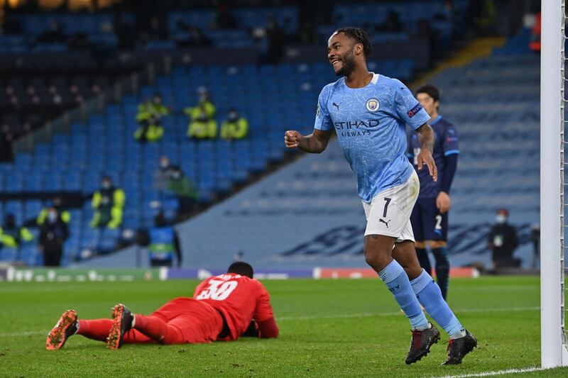 Manchester City's English midfielder Raheem Sterling celebrates scoring his team's third goal during the UEFA Champions League 1st round day 6 group C football match between Manchester City and Marseille at the Etihad Stadium in Manchester, north west England, on December 9, 2020.  / AFP / Paul ELLIS
