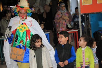 A clown entertains children in Ibn Zaydoun public park in Agadir on January 10. Photo: Elkhalil Elomari