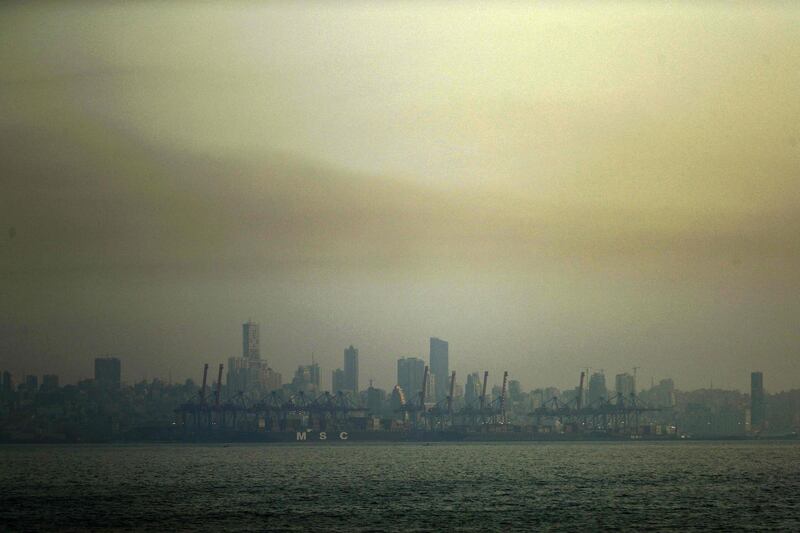 A picture taken from Dbayeh, north of Beirut, shows the skyline of the Lebanese capital covered in smog at sunset.  AFP