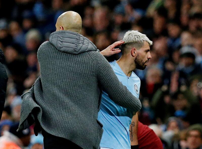 Manchester City's Sergio Aguero with manager Pep Guardiola as he was substituted. Reuters