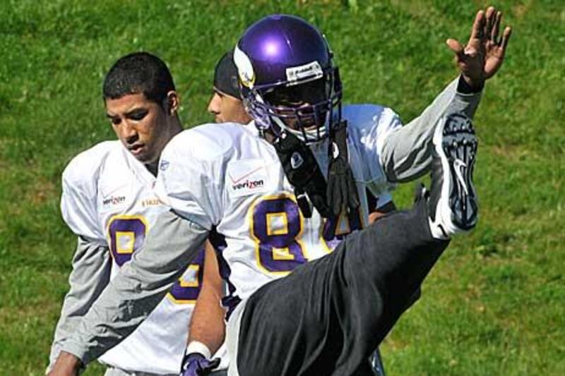 Randy Moss stretches at a Vikings practice.