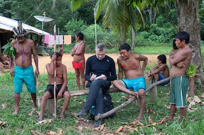 Dom Phillips with members of an indigenous community in the Brazilian Amazon. AFP