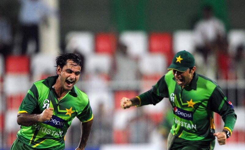 Pakistani spinner Mohammad Hafeez, left, has not been doing much celebrating of late with captain Misbah ul-Haq or any of his other teammates for that matter. Aamir Oureshi / AFP 