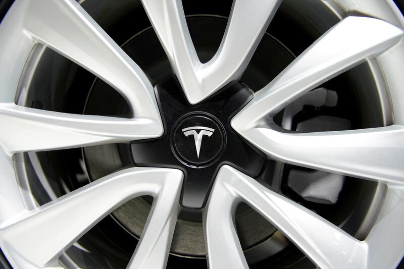 FILE PHOTO: A Tesla logo is seen on a wheel rim during the media day for the Shanghai auto show in Shanghai, China April 16, 2019. REUTERS/Aly Song/File Photo