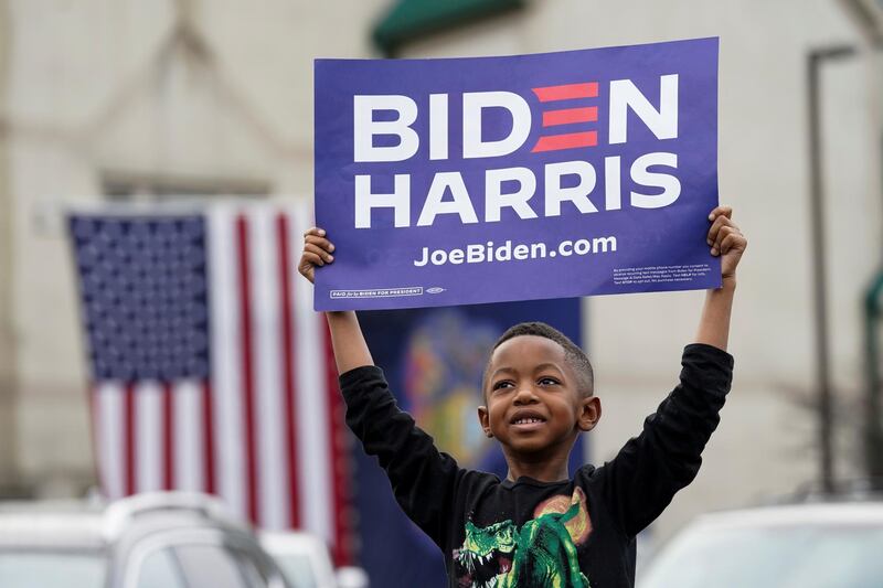 A child holds a sign as he attends US Democratic presidential candidate Joe Biden's campaign event in Philadelphia, Pennsylvania, US. Reuters