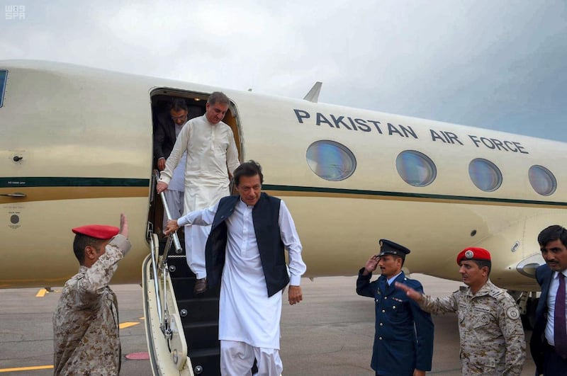 Pakistani Prime Minister Imran Khan steps off the plane in Jeddah. Saudi Press Agency