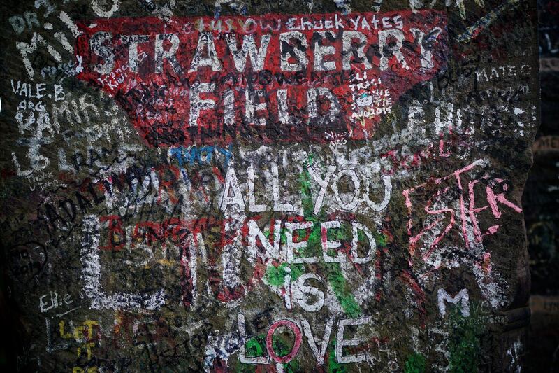 Graffiti covers the original entrance to Strawberry Field in Liverpool, England. All photos by Getty Images