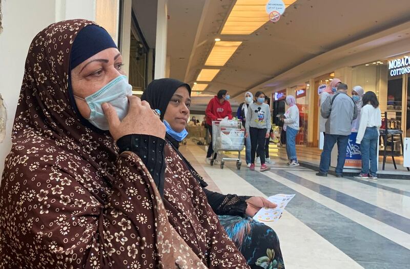 FILE PHOTO: Egyptians wear protective face masks inside City Centre mall ahead of Black Friday, amid the coronavirus disease (COVID-19) pandemic in the Cairo suburb of Maadi, Egypt November 26, 2020. REUTERS/Amr Abdallah Dalsh/File Photo