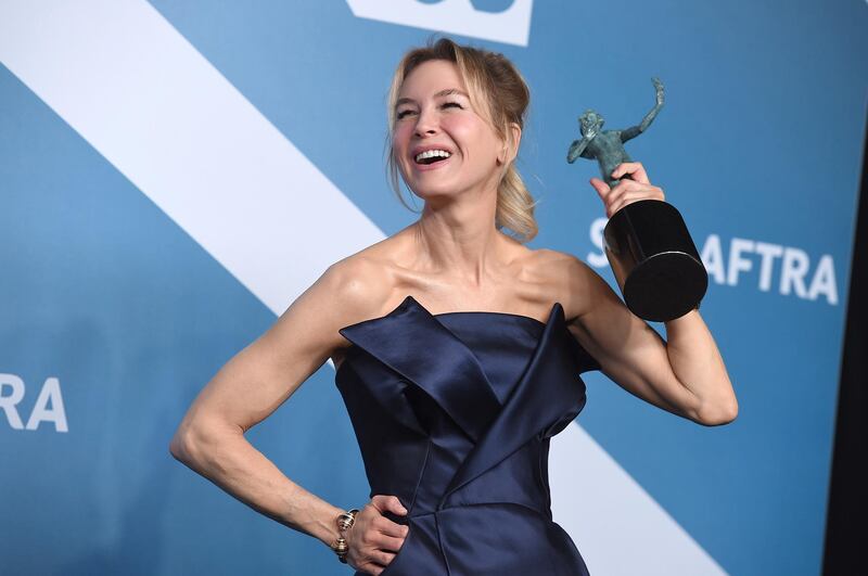 FILE - Renee Zellweger poses in the press room with the award for outstanding performance by a female actor in a leading role for "Judy" at the 26th annual Screen Actors Guild Awards on Jan. 19, 2020, in Los Angeles. Zellweger has earned her first Grammy nomination this year. The "Judy" soundtrack, which features Zellweger covering songs like "Over the Rainbow" and "The Trolley Song," is nominated for best traditional pop vocal album. (Photo by Jordan Strauss/Invision/AP, File)