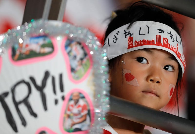 A young Japanese rugby fan waits for the start of the Rugby World Cup Pool A game at Tokyo Stadium in Japan. AP Photo