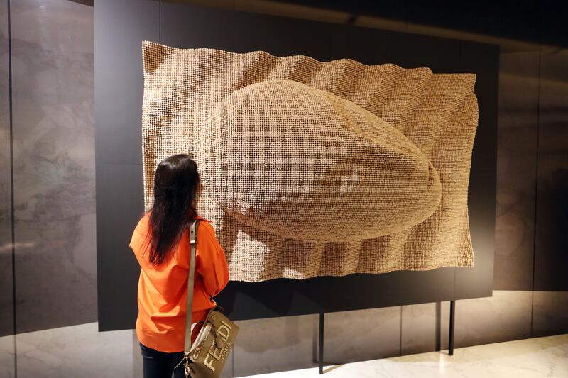 A collaborative artwork created by visitors to the Romanian Pavilion at Expo 2020 Dubai is being exhibited at the One Wall Gallery in Index Mall, Dubai. All photos: Chris Whiteoak / The National