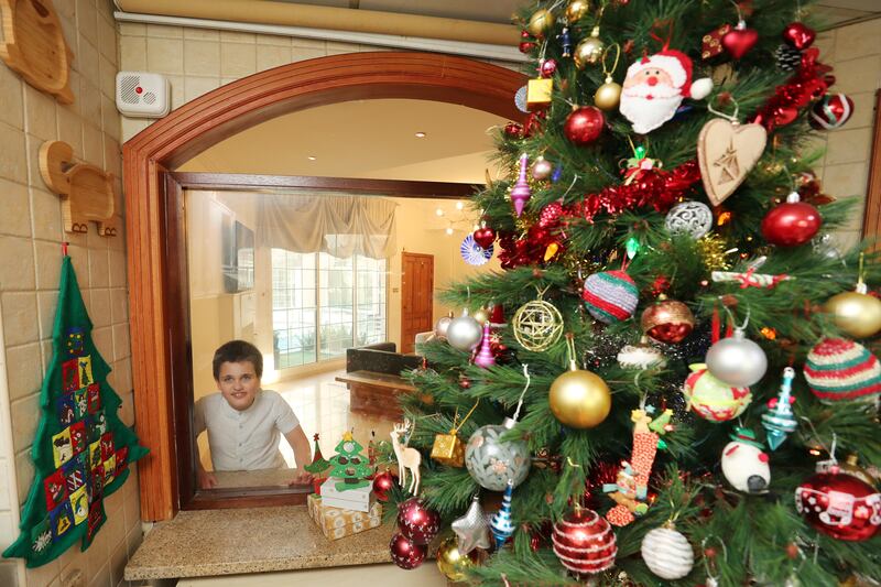 How Sam Ray and his family celebrate Christmas in their house in Mirdif, Dubai. Sam has Angelman syndrome. Mirdif, Dubai. All photo: Chris Whiteoak / The National