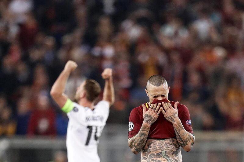 Roma's Radja Nainggolan, right, looks dejected a tthe final whistle. Riccardo Antimiani /  EPA