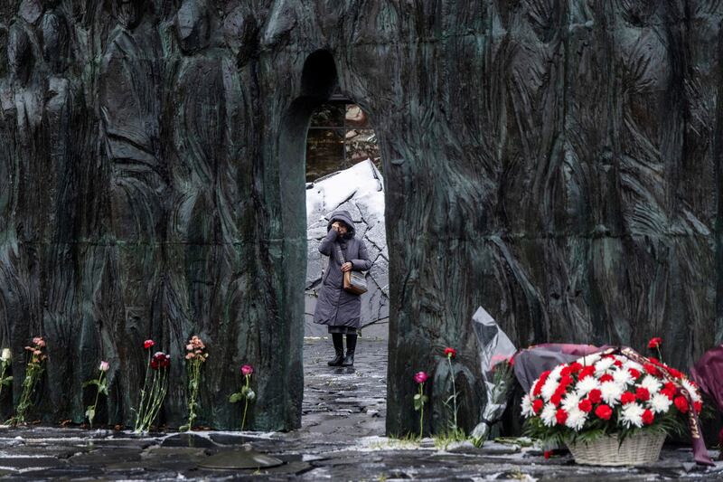 A woman at the Wall of Grief monument on a remembrance day for the victims of political repressions in Moscow. Reuters