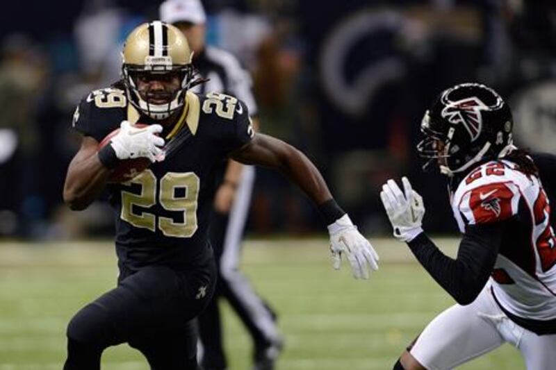 New Orleans Saints' Chris Ivory breaks past Atlanta's Asante Samuel on his way to a touchdown.