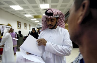Abu Dhabi, September, 25, 2018: Khaled AlMaazmi, Assitant Deputy General Director, EIBC, check the papers of the Amnesty seekers at the Tasheel centre at Al Raha Mall in Abu Dhabi. Satish Kumar for the National/ Story by Haneen Dajani