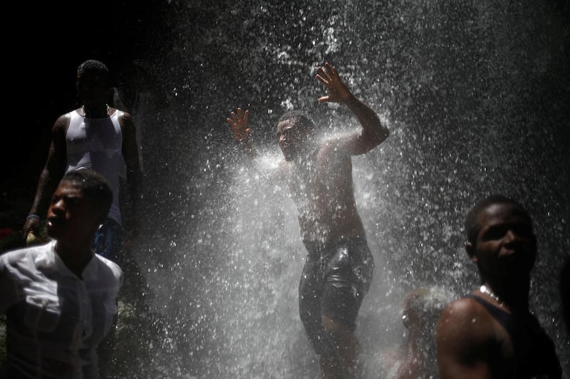 Pilgrims take a bath during the celebration of the annual pilgrimage to the waterfall in Saut D'Eau, Haiti. Andres Martinez Casares/Reuters