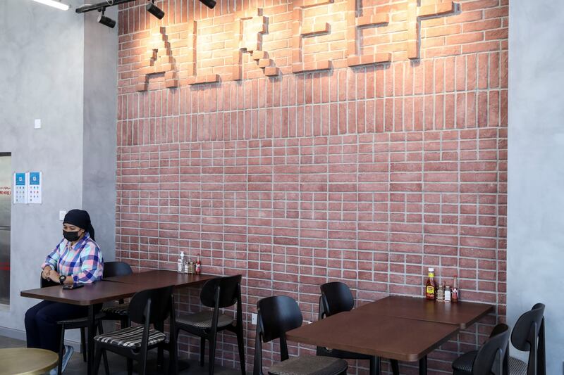 The interior space of Al Reef Lebanese Bakery has one wall made of terracotta bricks, as a nod towards the original.