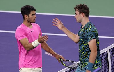 Carlos Alcaraz and Jack Draper meet at the net after Draper retires from their Indian Wells match. AFP