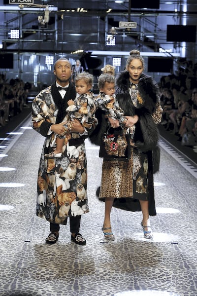 Jason and Amanda Harvey with their twins at the Dolce & Gabbana autumn/winter 2017 show