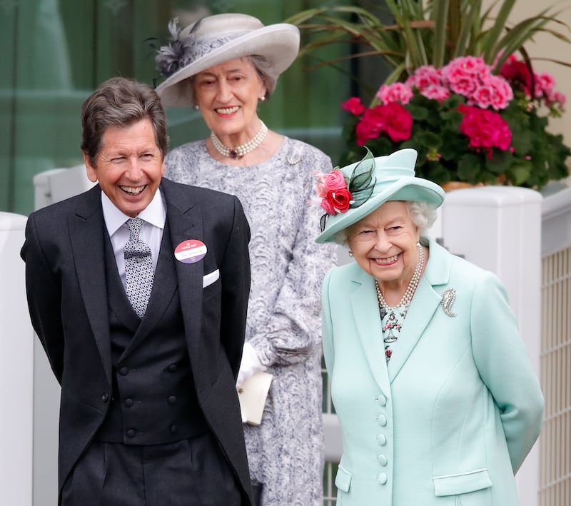 Queen Elizabeth, accompanied by her racing manager John Warren and her lady-in-waiting Lady Susan at Royal Ascot in 2021. Getty Images