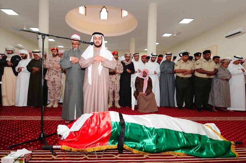 Men perform funeral prayers over the body of Ahmed Al Mazroui at Shabieat Al Hossen Mosque in Wadi Al Helo. Prayers were led by Sheikh Salem Al Qasimi, chairman of the Sharjah Ruler’s Office. Wam