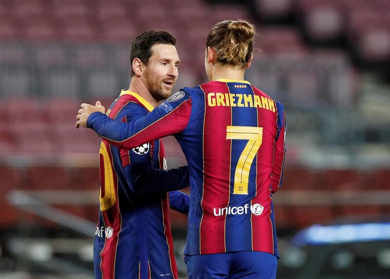 Lionel Messi celebrates with Antoine Griezmann after scoring for Barcelona against Dynamo Kiev. Reuters