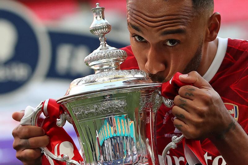 Arsenal striker Pierre-Emerick Aubameyang kisses the FA Cup after the 2-1 win over Chelsea in 2020. AFP