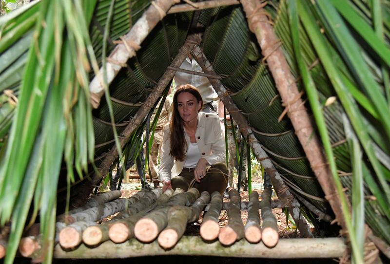 The duchess looks at a temporary shelter built from palm trees. Getty Images