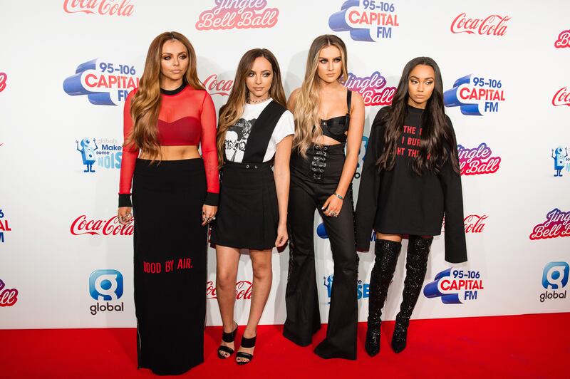 Jesy Nelson, in a black shirt and sheer red top, with her Little Mix bandmates at the Capital's Jingle Bell Ball on December 3, 2016